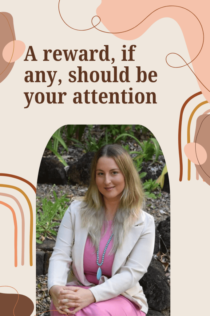 A woman with long hair wearing a pink dress and a white blazer sits against a natural background, surrounded by greenery. The image features decorative elements and text that reads, 'A reward, if any, should be your attention.'